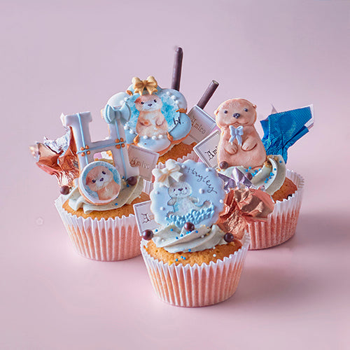 Amico 客製化寶寶生日蛋糕與杯子蛋糕組合，糖霜裝飾為可愛動物與數字設計，適合兒童週歲派對慶祝。
