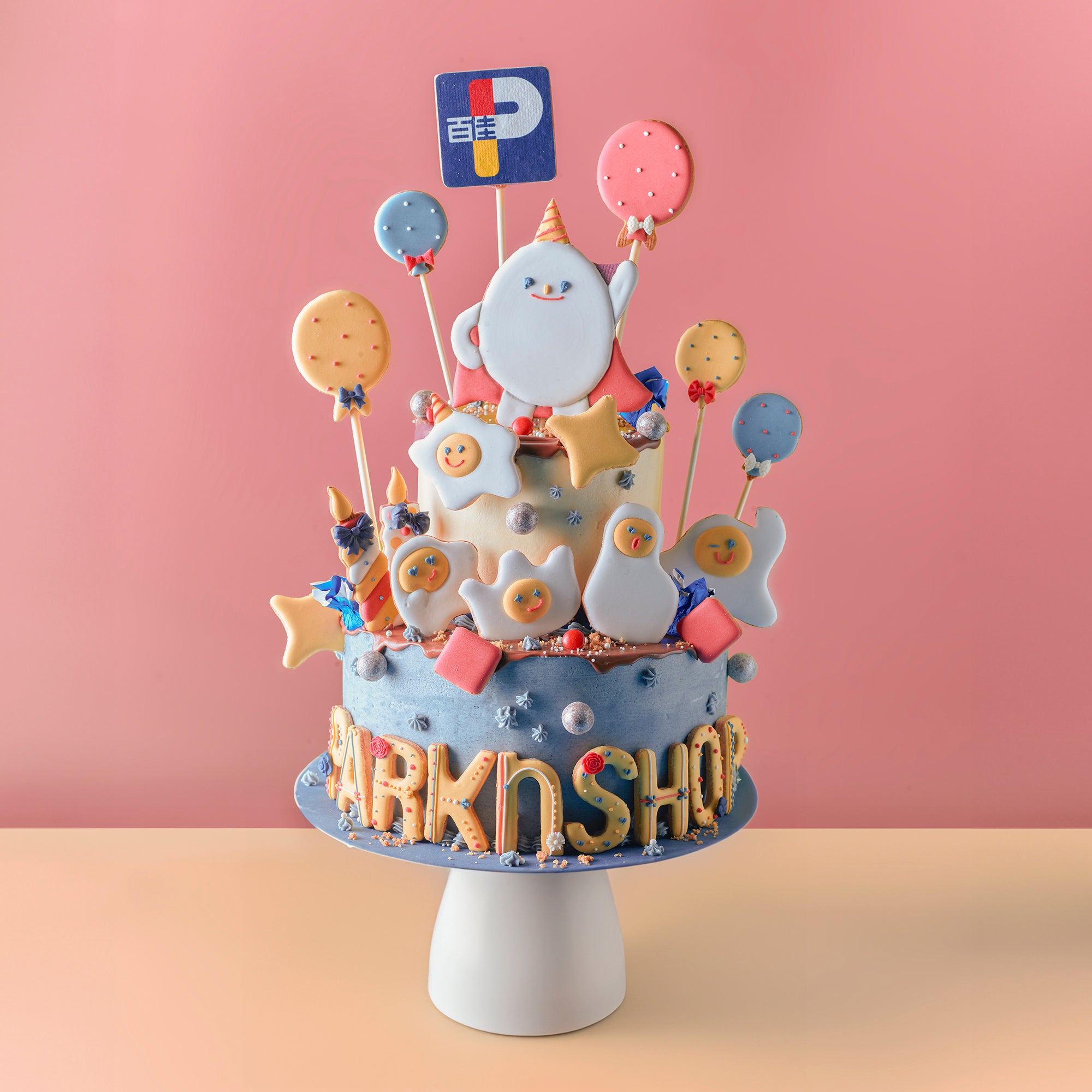 Amico 為百佳 PARKN SHOP 設計的客製化企業蛋糕，搭配品牌 logo、吉祥物與派對裝飾，適合慶典活動。